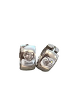 A pair of polished sterling silver huggie earrings with a heart-shaped clear cubic zarconia gemstones, displayed on a white background.