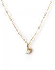 A solid 14k gold necklace with a diamond horn pendant on a white background.