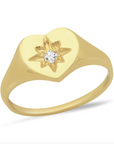 14k gold ring with a heart shape and star design with a diamond center on a white background