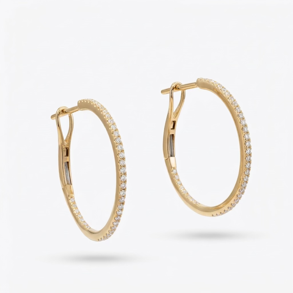 Solid 14k yellow gold diamond pave hoop earrings, with a hinge back and 28 hand-set diamonds, against a white background.