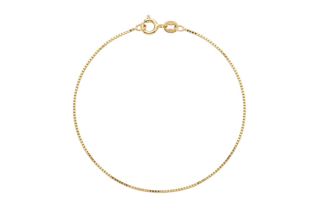 A solid 14k yellow gold delicate box chain bracelet with a spring round clasp, against a white background. 