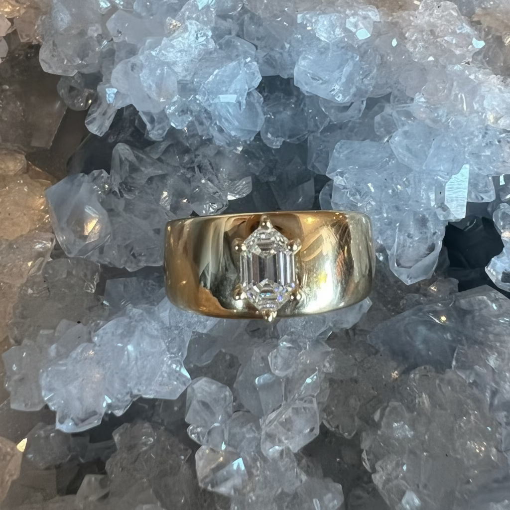 Thick 14k yellow gold ring, with a prong set hexagon diamond against a crystal background