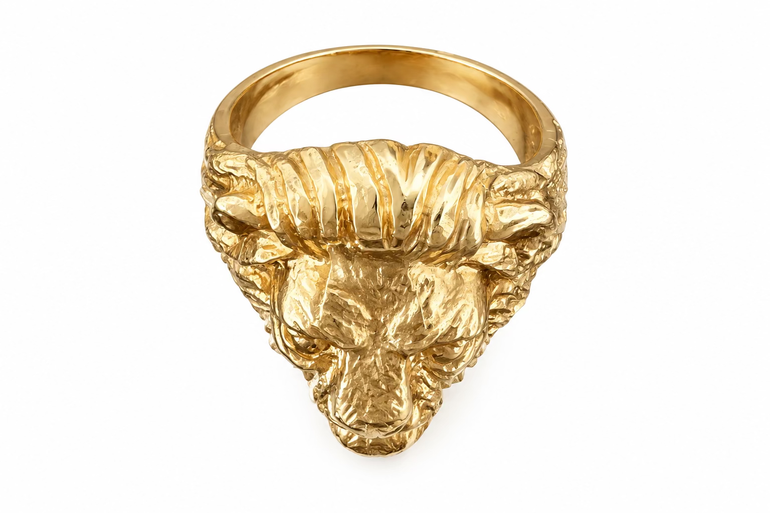 The top view of the Aslan King of Beasts Gold Vermeil Lion Ring. Showing the thick band, and detailing with the lions furrowed brow and mane. Against an Amethyst crystal background. 