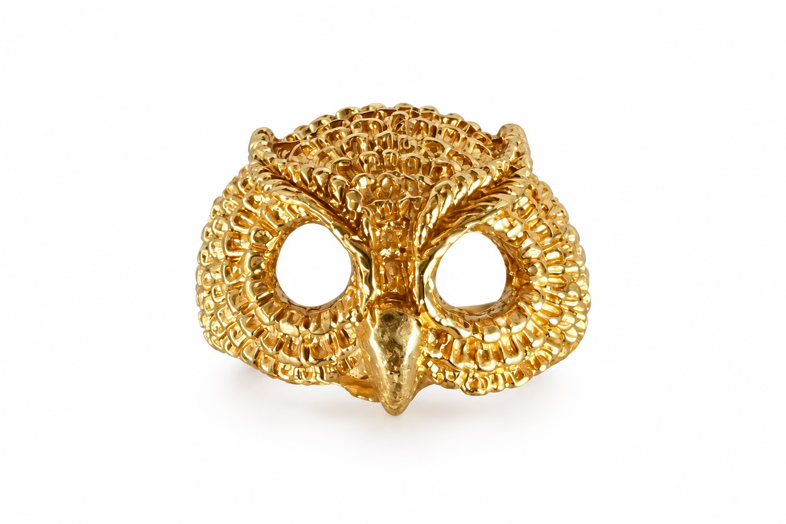 A Gold Vermeil textured feather owl ring, inspired by Athena. Against a crystal background