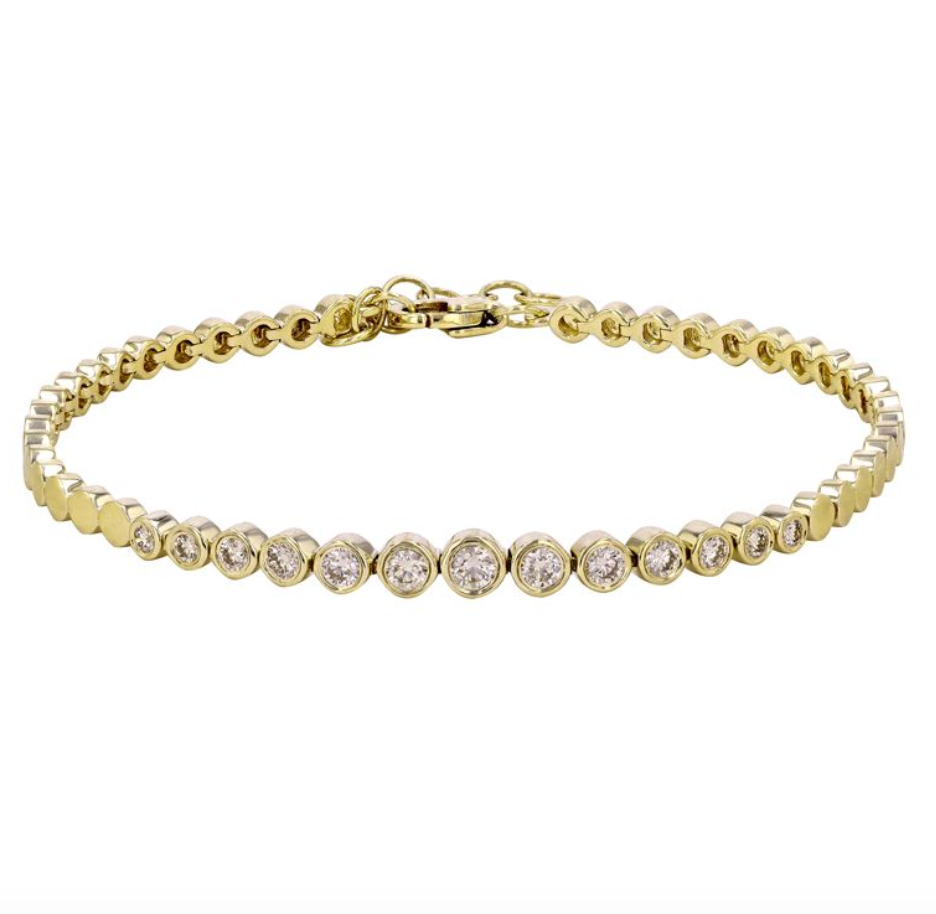 Solid 14k yellow gold tennis bracelet with 13 bezel set diamonds, varying in size. A continued circle link style throughout, creating a thick style, without compromising comfort. Finished with a lobster clasp, all set against a white background.
