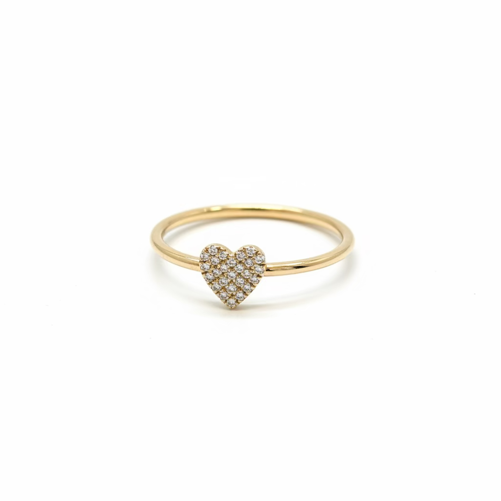 Delicate solid 14k gold heart-shaped ring with pave diamonds on a crystal. 
