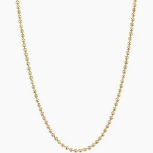 A gold vermeil ball chain necklace on a white background