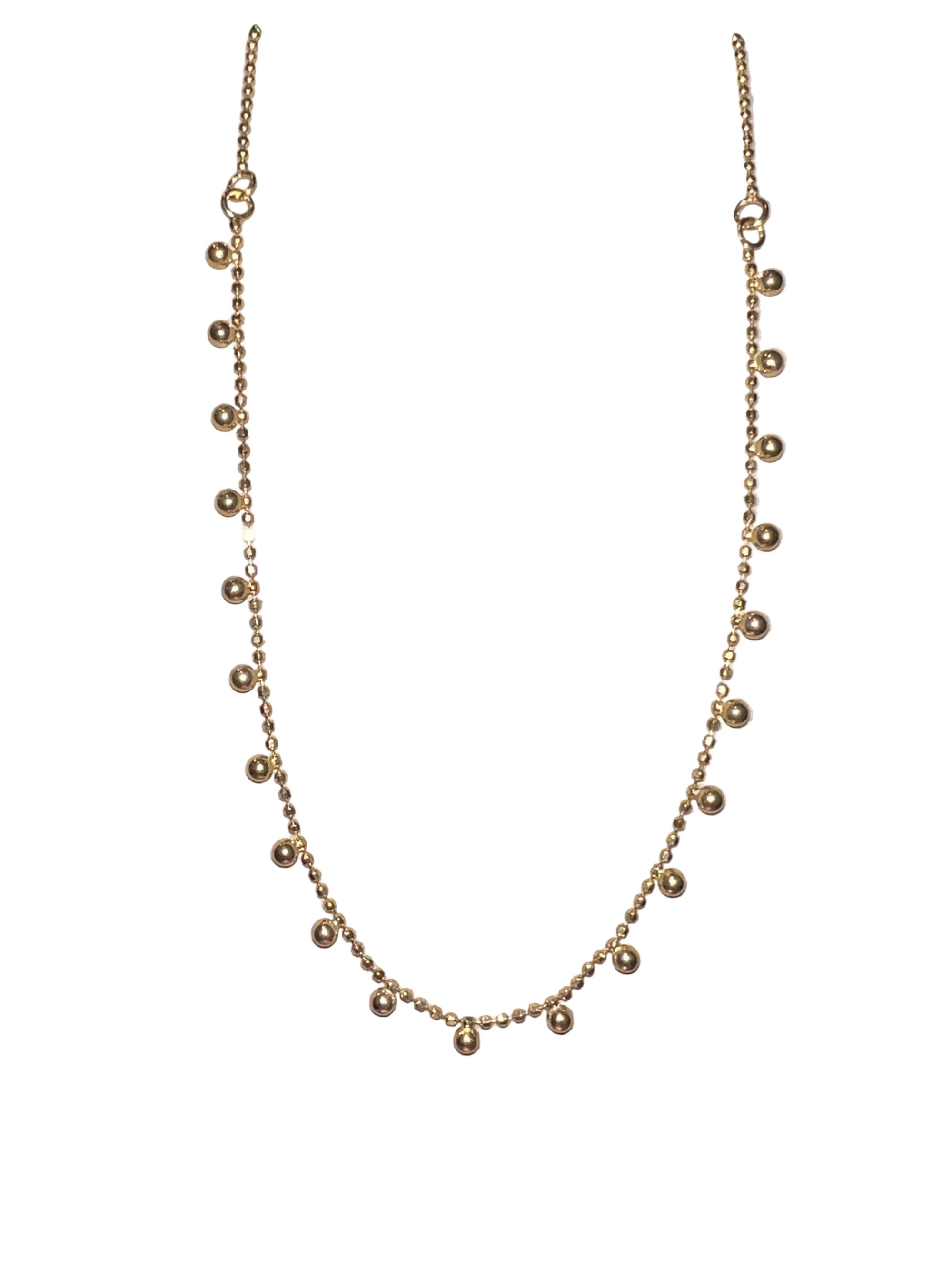 A gold vermeil ball chain necklace against a white background.