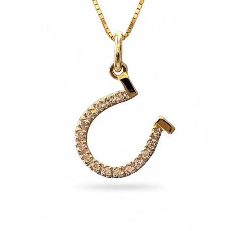 Solid 14k Yellow Gold Horseshoe pendant with 18 VS1 Diamonds in a pave setting. With a gold box chain, against a celestite crystal background. 