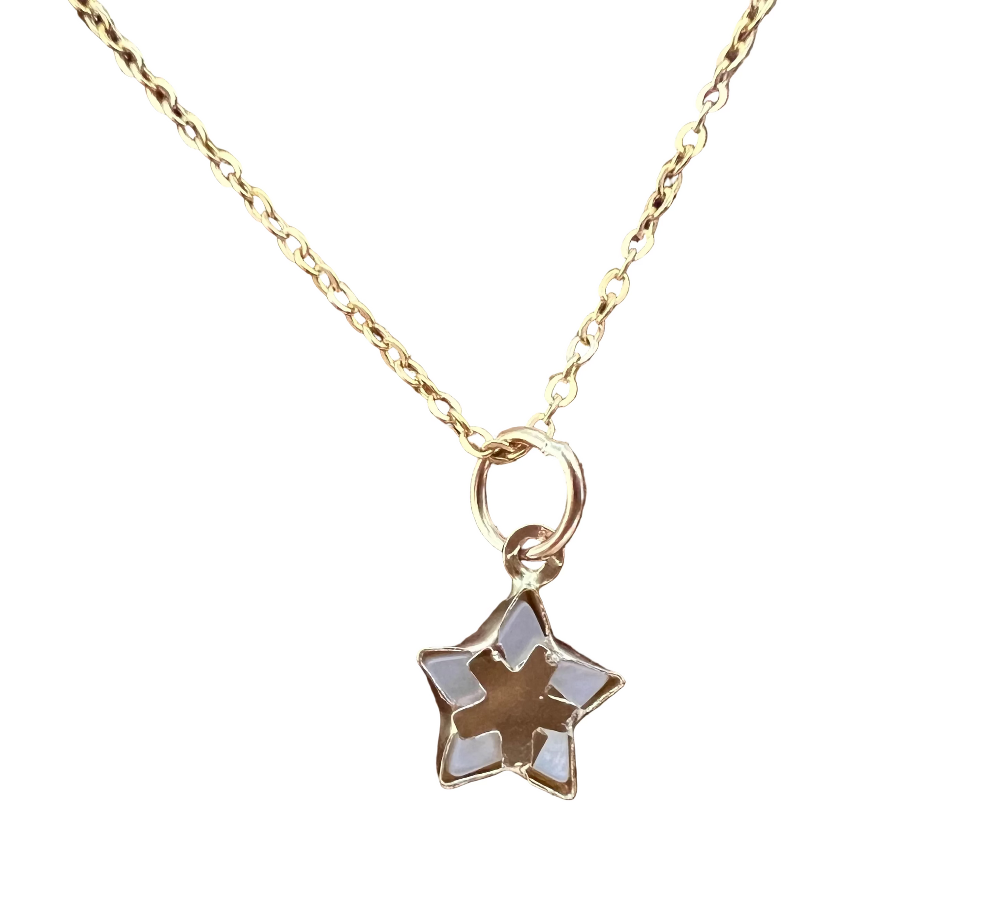 A 14k gold cable chain necklace with a five-pointed star pendant featuring mother of pearl white inlay, with a white background.