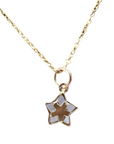A 14k gold cable chain necklace with a five-pointed star pendant featuring mother of pearl white inlay, with a white background.