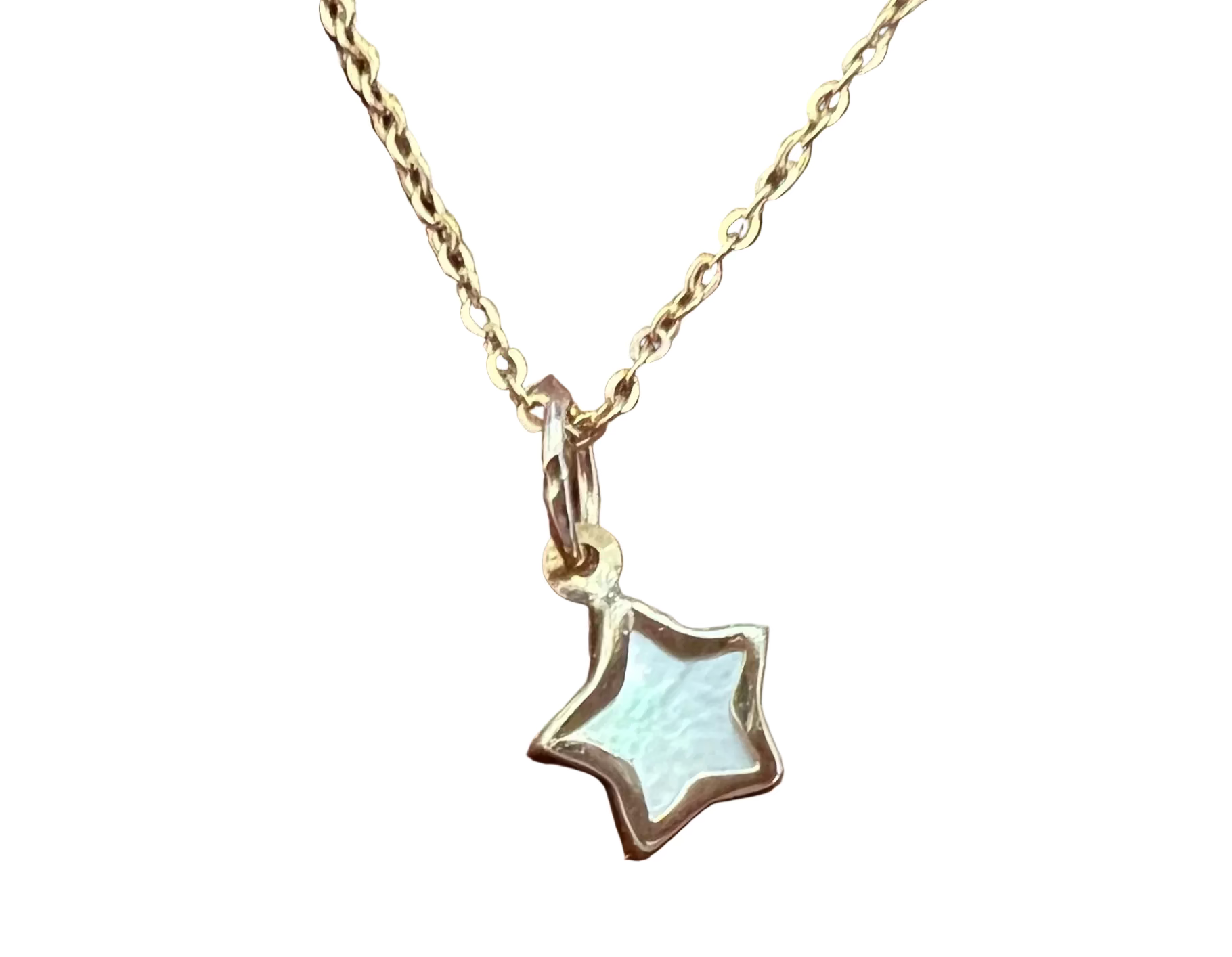 A 14k gold star pendant necklace with a milky white inlay created by the radiance of the mother of pearl, with a plain white background. 