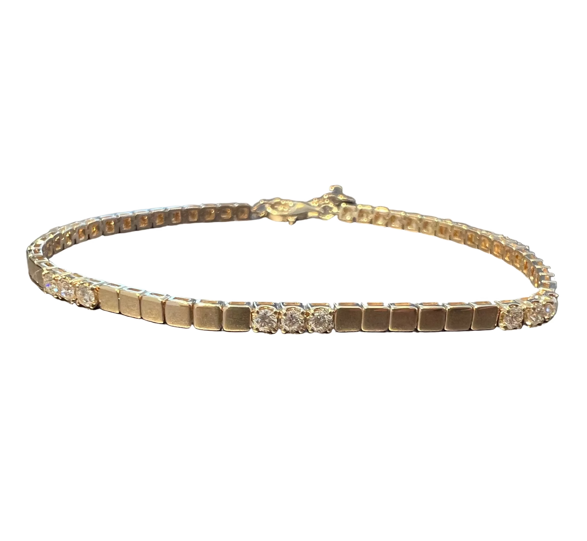 A 14k yellow gold tennis bracelet with three diamond clusters set along the front, displayed, with six gold links in between. Total length 7 inches, 6 inches of links plus 1 inch extender, on a white background. 