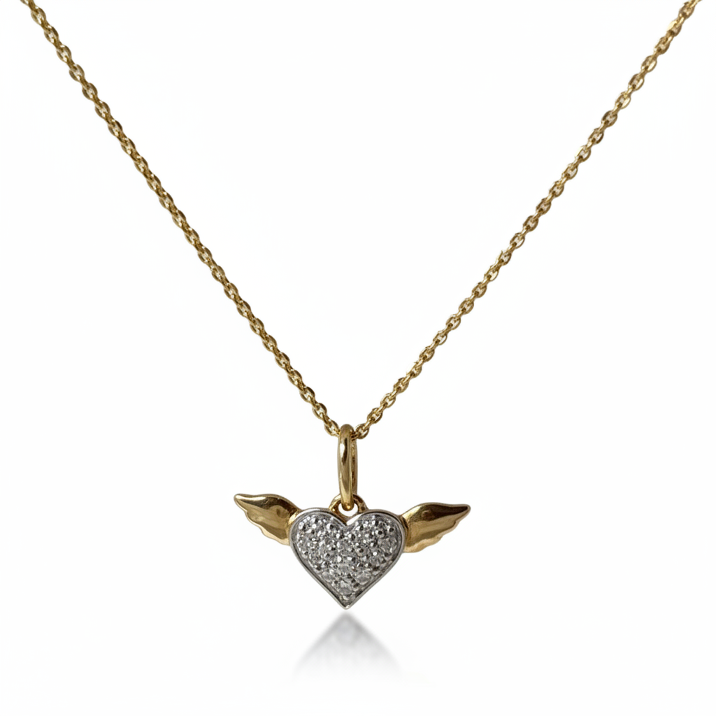 14k gold necklace with a winged heart-shaped pendant  with pave diamonds on a 16 inch cable chain with a crystal background.